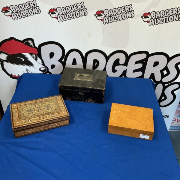 Vintage cigar boxes lot with intricate wooden carvings.