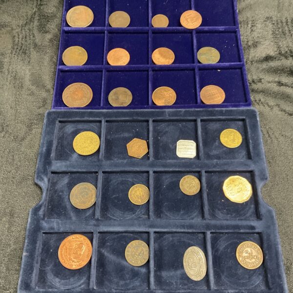 Vintage coin collection in a blue tray, featuring various British coins.