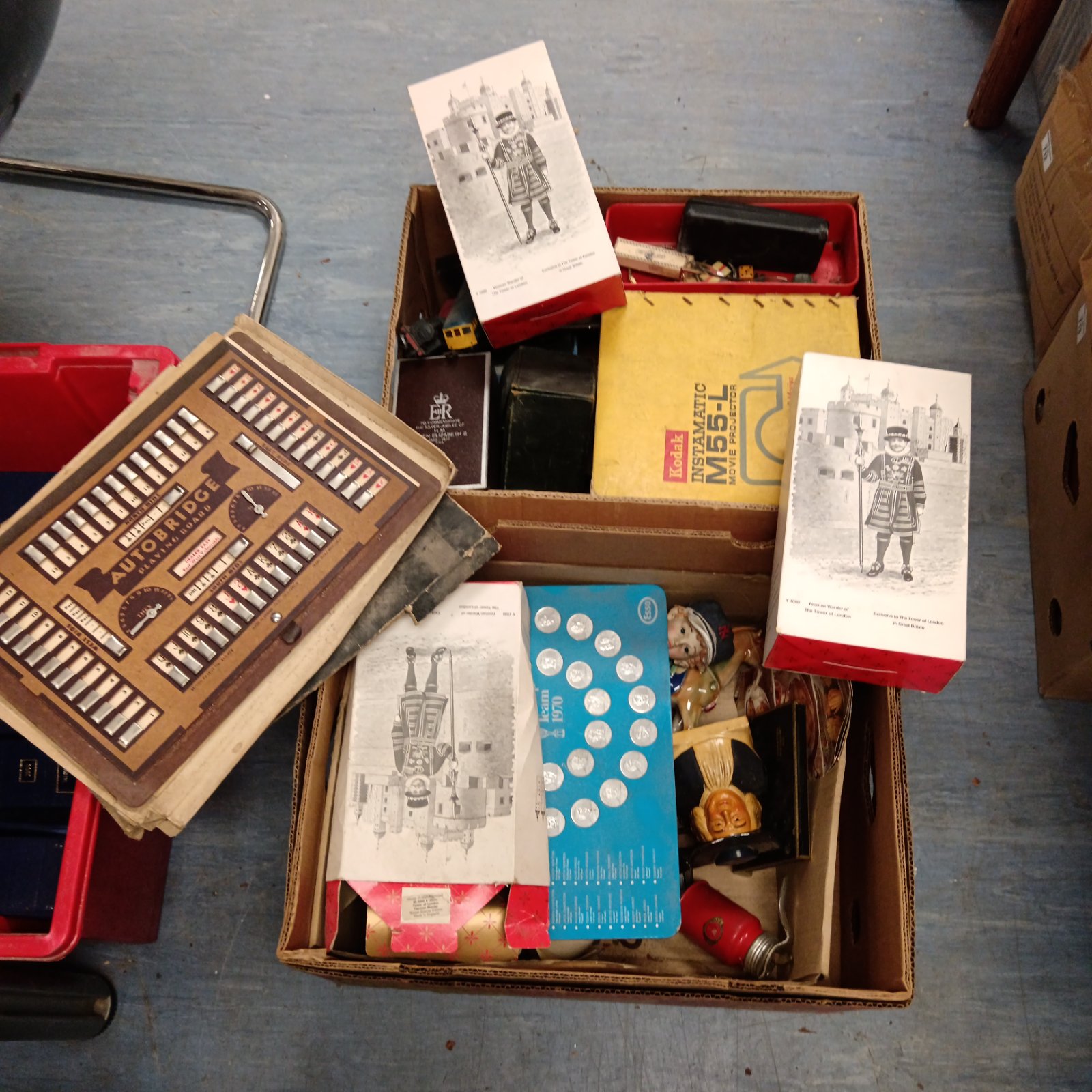 Vintage coin and figure collection including 1970 World Cup memorabilia.