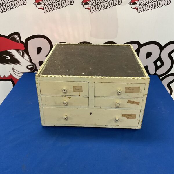 Vintage wooden collectors chest with small drawers.