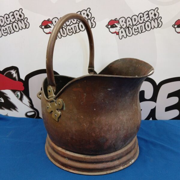 Vintage copper helmet coal scuttle with patina.