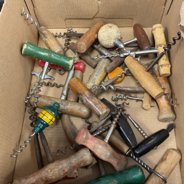 Vintage corkscrew collection with wooden handles and metal worms.