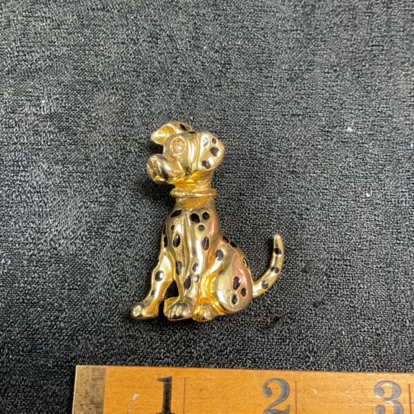 Vintage gold tone Dalmatian brooch with black enamel spots.