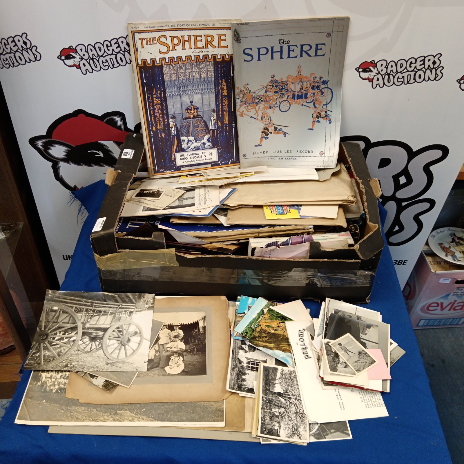 Vintage ephemera collection with antique photographs and postcards.