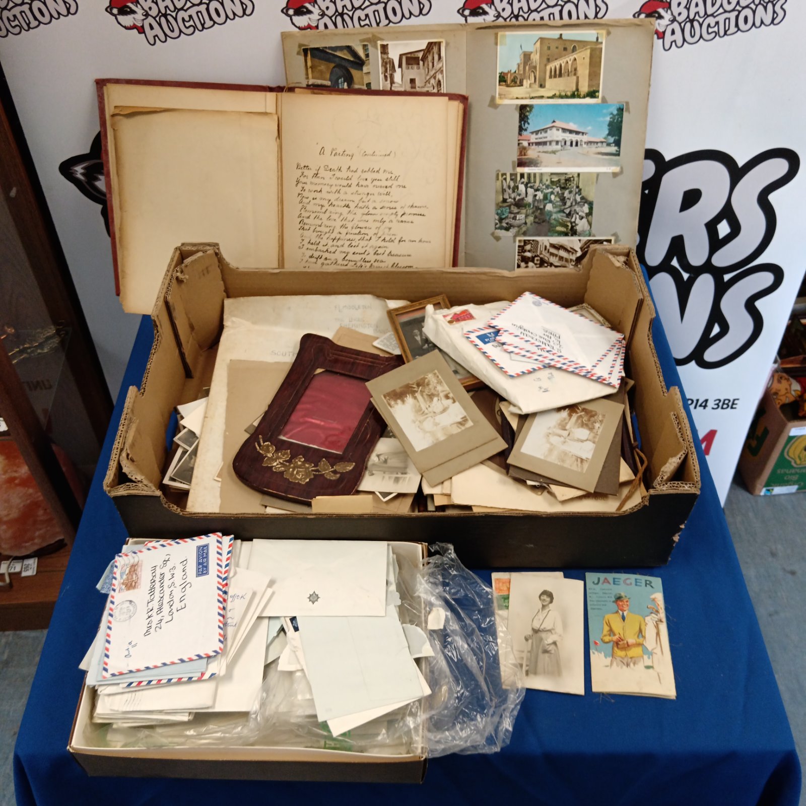 Vintage ephemera collection with antique photographs and postcards.