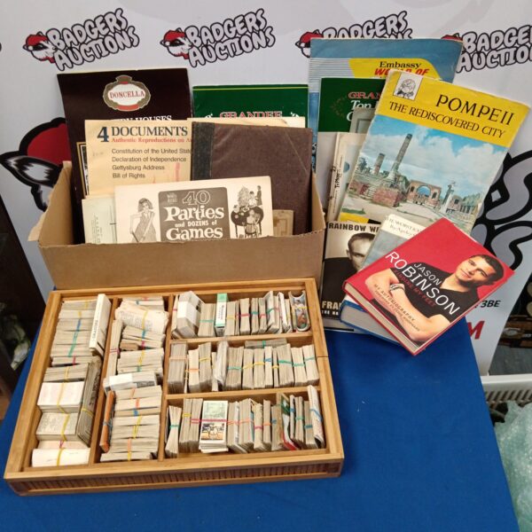 Large lot of vintage ephemera including cigarette cards and books.