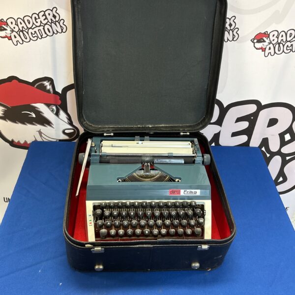 Vintage Erika Daro mechanical typewriter in its original case.