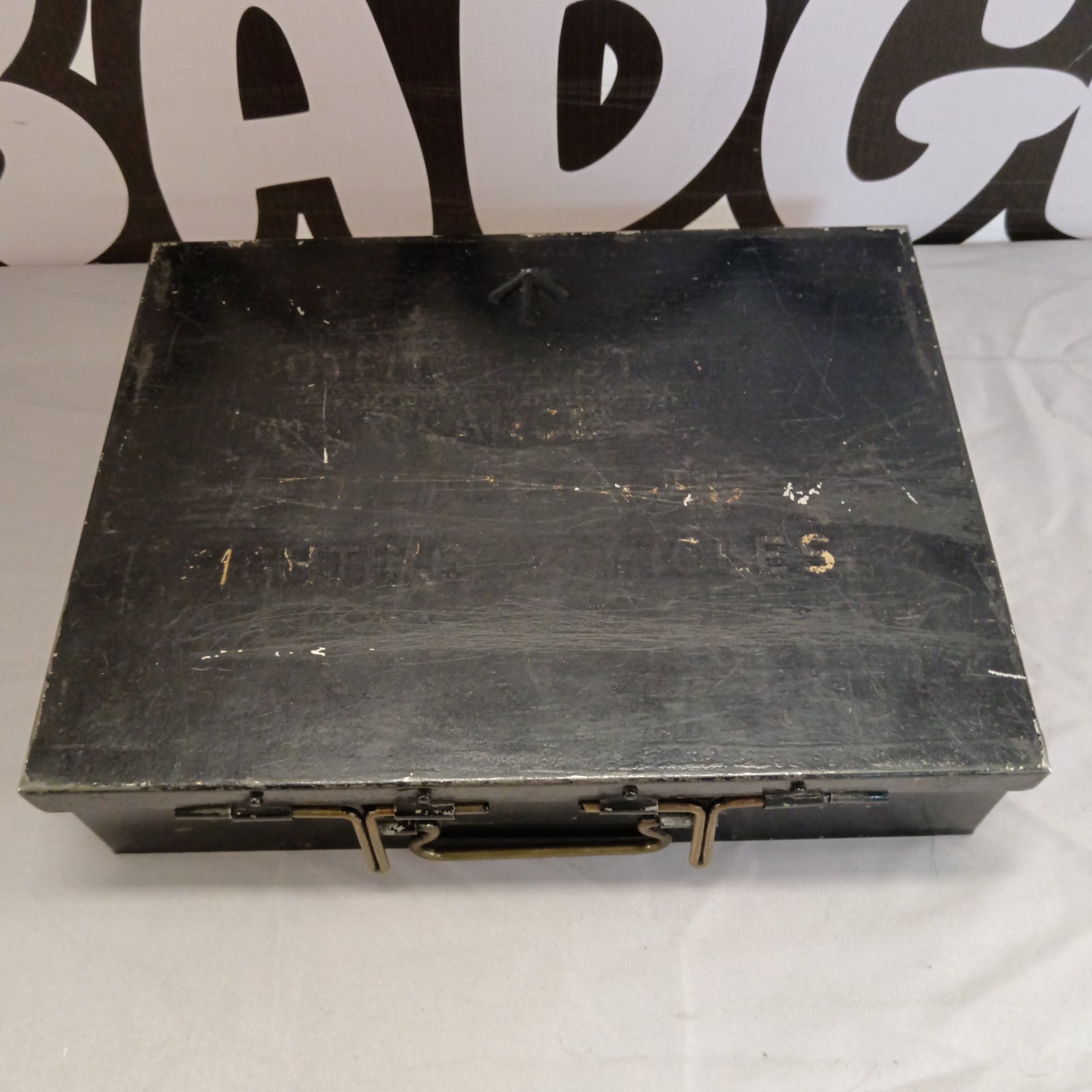 Vintage military first aid tin with hinged lid.