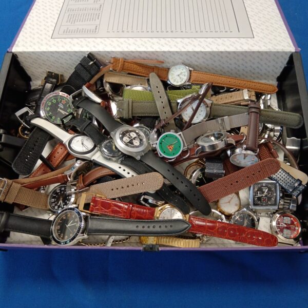 Vintage gent's watch collection lot with Swatch and Monaco timepieces.