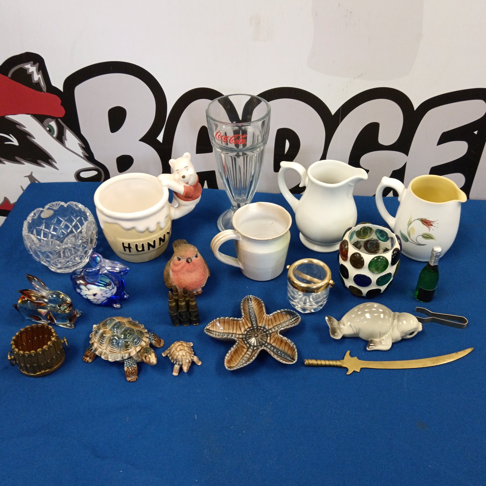 Vintage glass and ceramics collection with jugs and animal figurines.