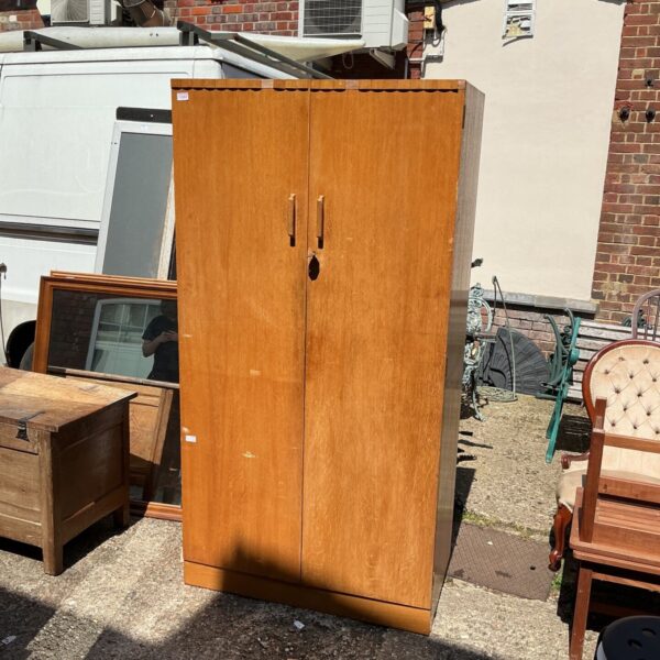 Vintage Gomme wardrobe in light wood, front view.