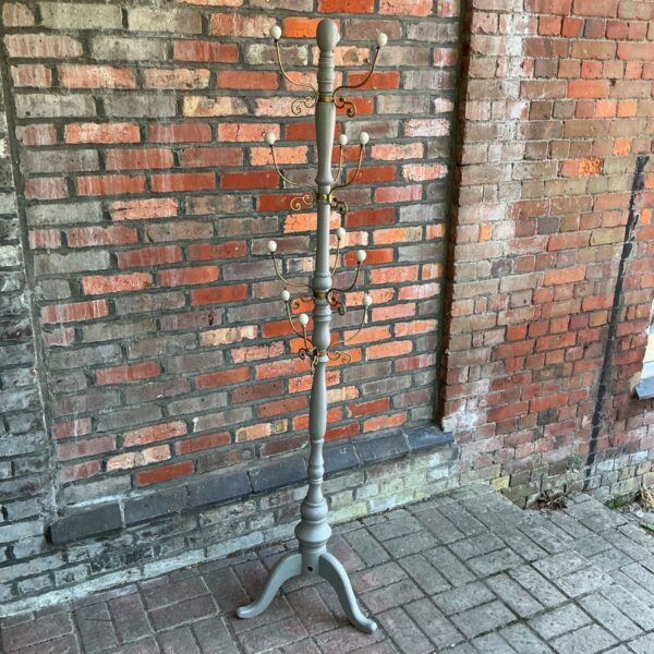 Vintage grey painted metal coat rack with hooks.