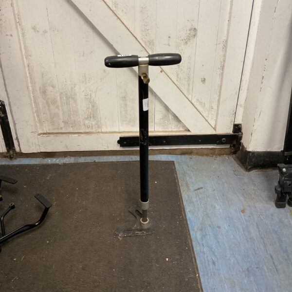Vintage hand pump for inflating tires or other items.