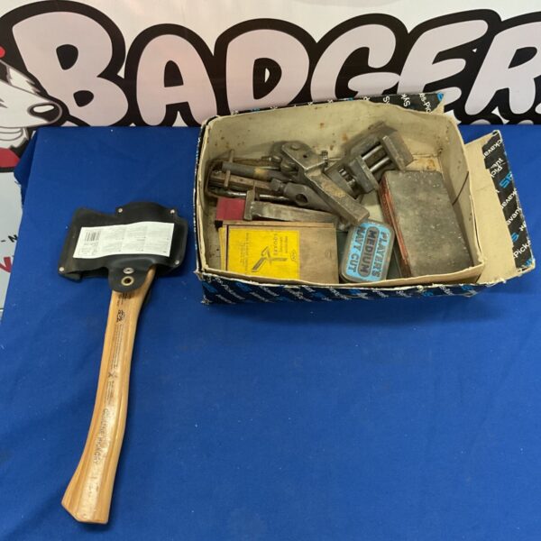 Vintage hatchet with wooden handle, a classic woodworking tool.