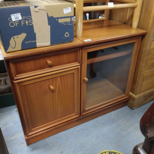 Vintage wooden HiFi media cabinet with glass doors.