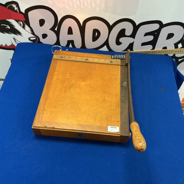 Vintage Jaycee paper guillotine with wooden handle and metal blade.