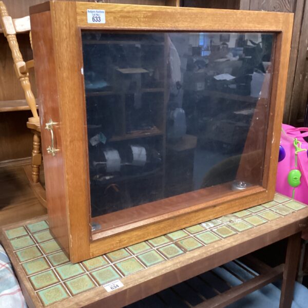 Vintage jewellery display cabinet with glass front and wooden frame.