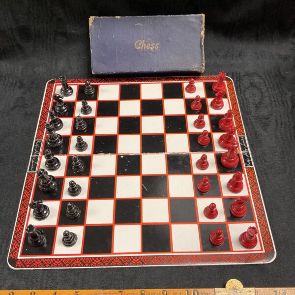 Vintage Kitfix lead chess set with folding board and lead pieces.