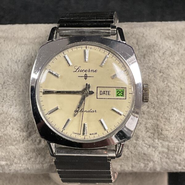 Vintage Lucerne calendar watch with cream dial and black markers.