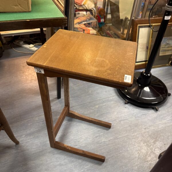 Vintage mahogany side table with angled legs.