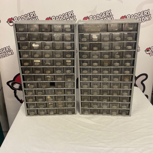 Vintage metal parts storage shelves with multiple compartments.