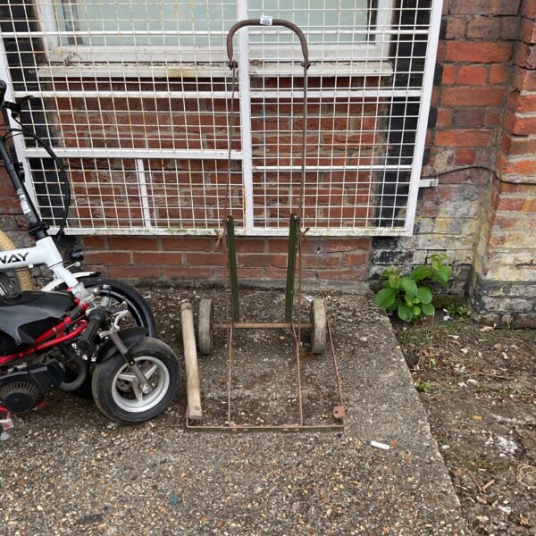Vintage metal sack barrow with two wheels, ideal for garden or DIY use.
