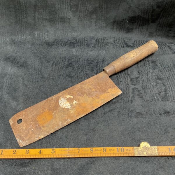 Vintage 1942 military log splitter with a worn steel blade.