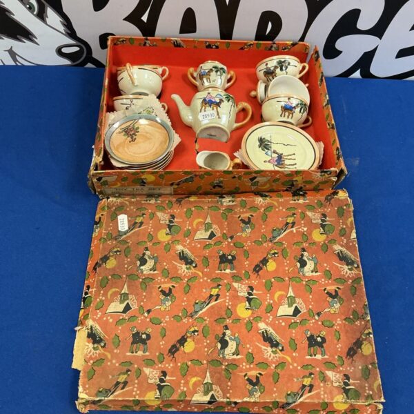 Vintage miniature tea set with floral design, collectible porcelain.