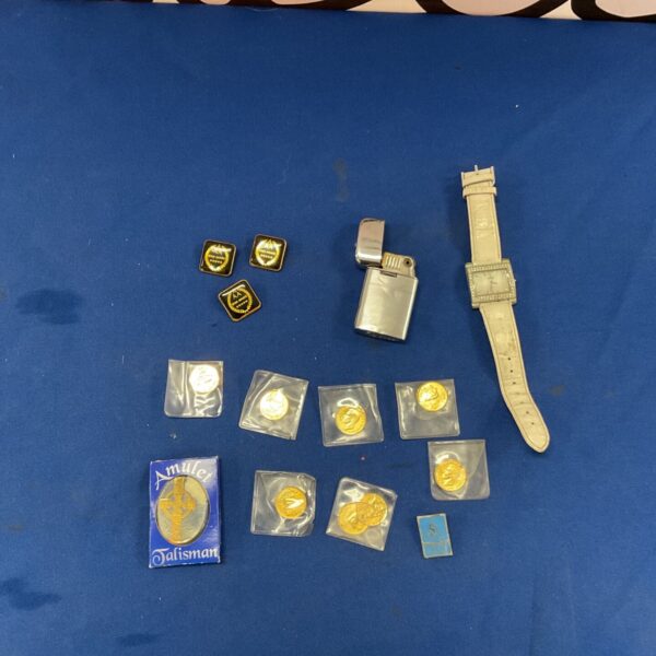 Vintage mixed lot including a Haurex watch and collectible badges.