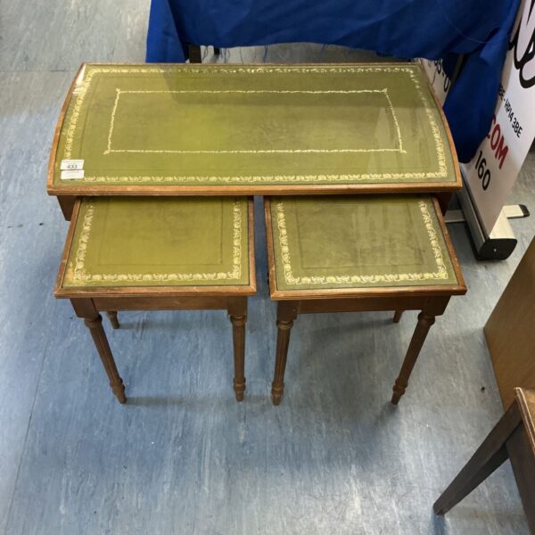 Vintage nest of tables with leather and glass tops.