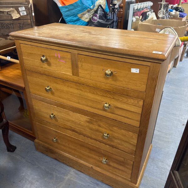 Vintage oak chest of drawers for bedroom storage and restoration.