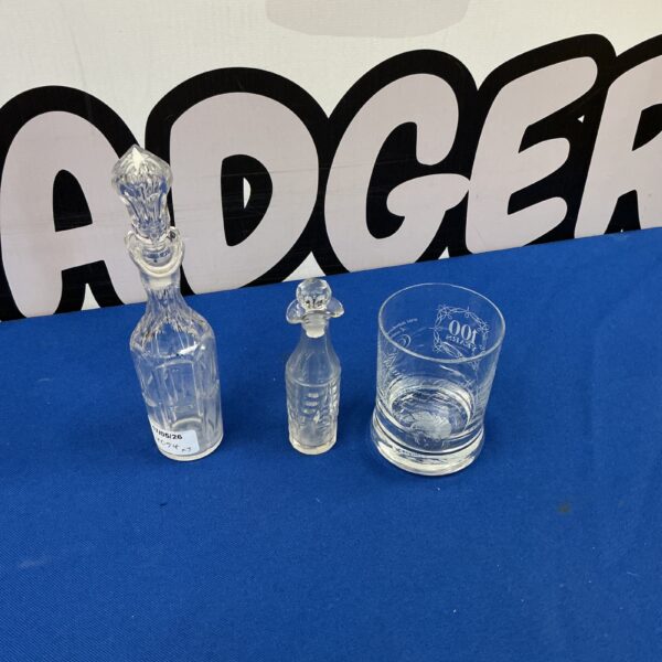 Vintage perfume bottles and Famous Grouse glass for collectors.