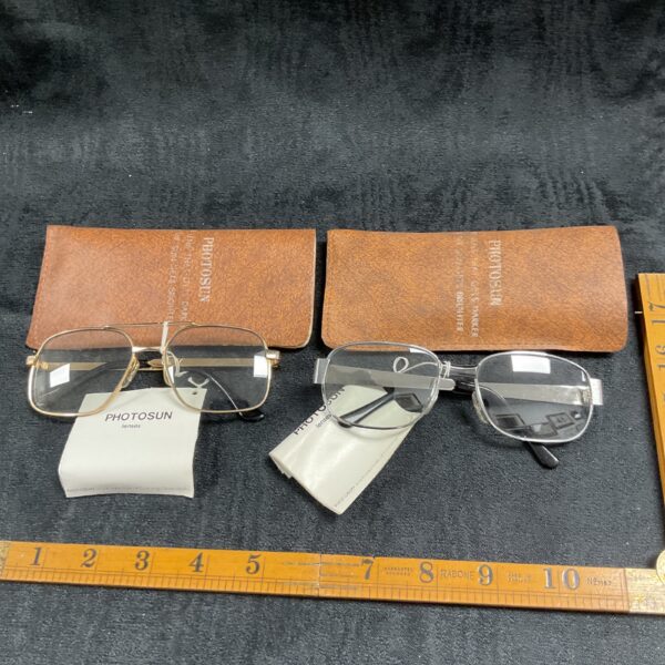 Vintage Photosun sunglasses with gold aviator frames and reactive lenses.