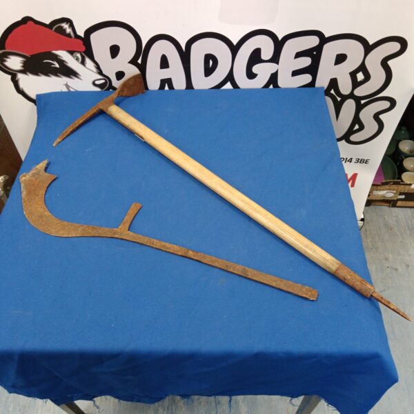 Vintage pick axe and African throwing sword set for collectors.