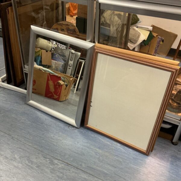 Vintage picture frames with mirrors for wall decor.