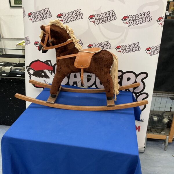 Vintage plush rocking horse for children's playroom.