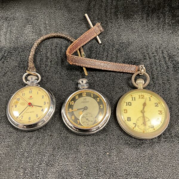 Vintage pocket watch lot including Smith and Ingersoll timepieces.