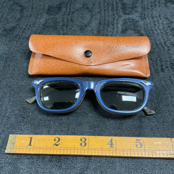Vintage blue Polaroid sunglasses with original case.