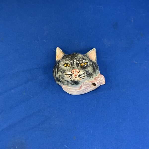 Vintage porcelain cat face wall plaque, detailed painted design.