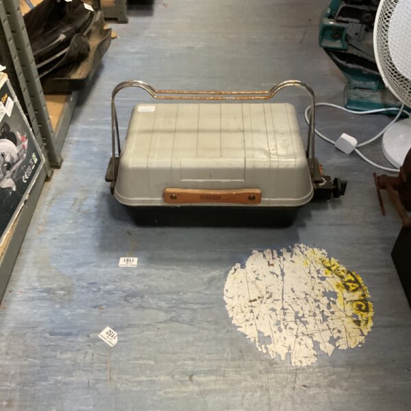Vintage portable gas barbecue with metal frame and handle.