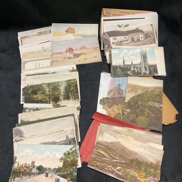Vintage postcard collection featuring various scenes and imagery.