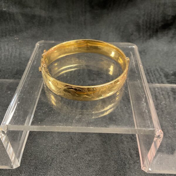 Vintage rolled gold cuff bracelet with embossed floral design.