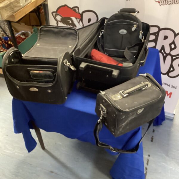 Vintage Samsonite luggage set with a suitcase and travel cases.