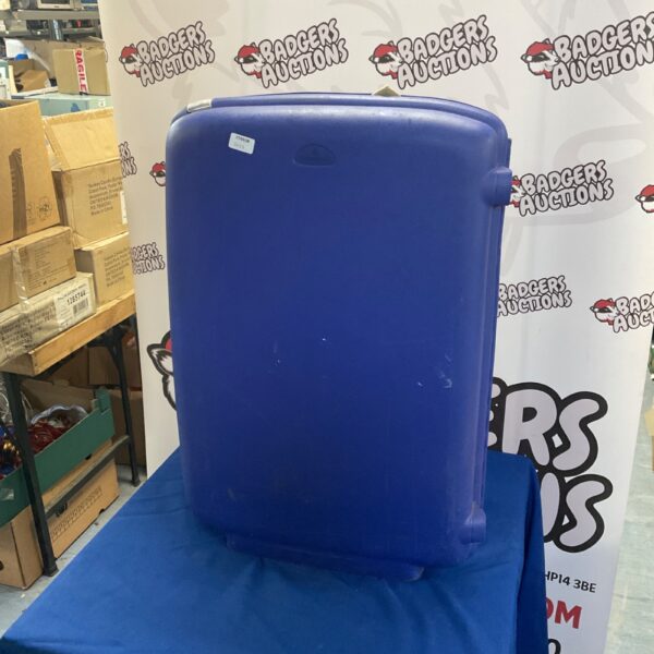 Vintage blue Samsonite suitcase filled with clothes.