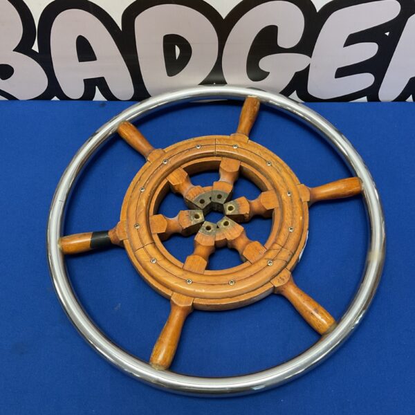 Vintage 17 inch ships wheel with chrome surround.
