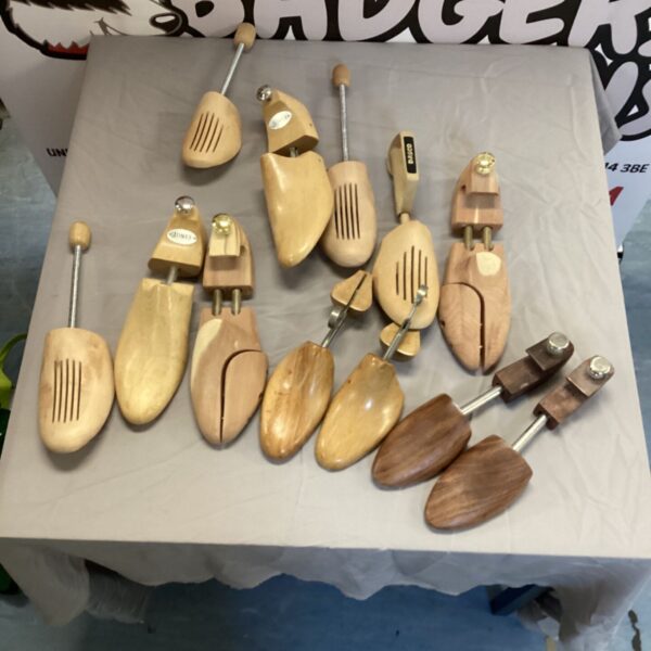 Vintage wooden shoe lasts including Jones brand, for shoe repair.