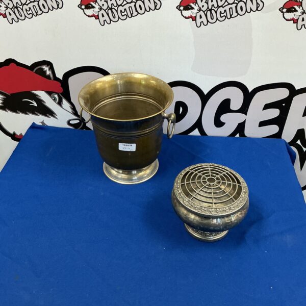 Vintage silverplate champagne bucket and rose bowl set on display.