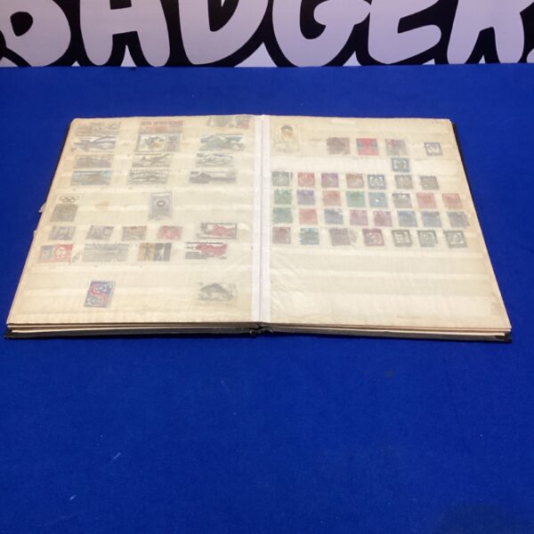 Vintage stamp collection album with world stamps inside.