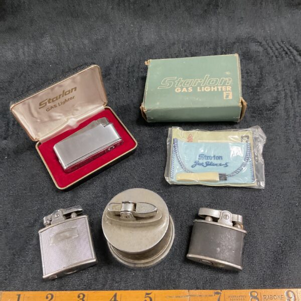 Vintage Starlon gas lighter in original box, collectible item.