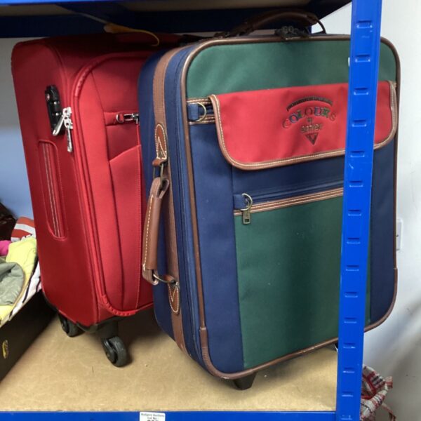 Red Antler vintage suitcase with black trim.